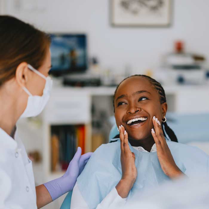 Happy Patient at Dental Clinic After Successful Checkup